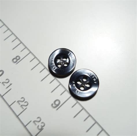 dior sewing buttons.